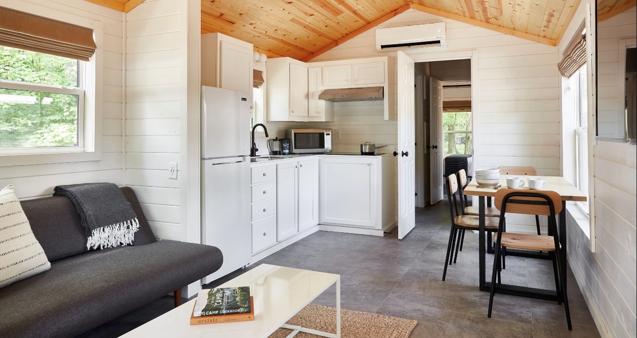 Accommodation kitchenette and seating shown on the AutoCamp Catskills page