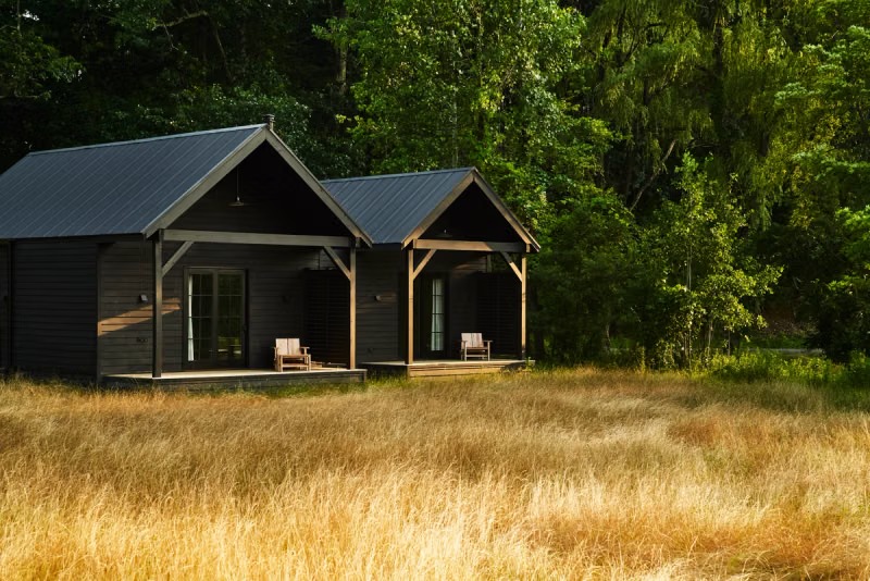 INNESS cabins beside a meadow
