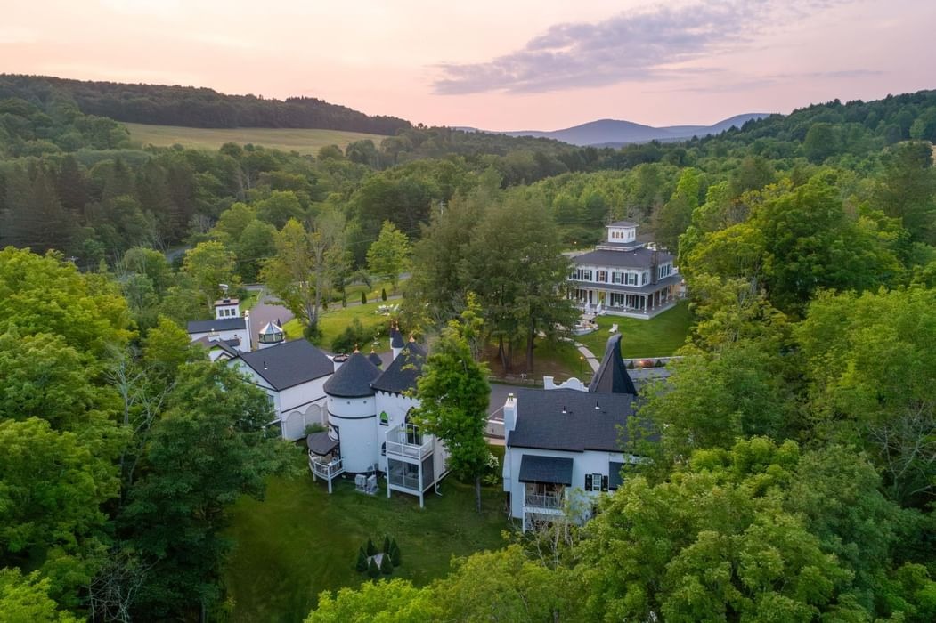 The Roxbury grounds and buildings surrounded by green hills