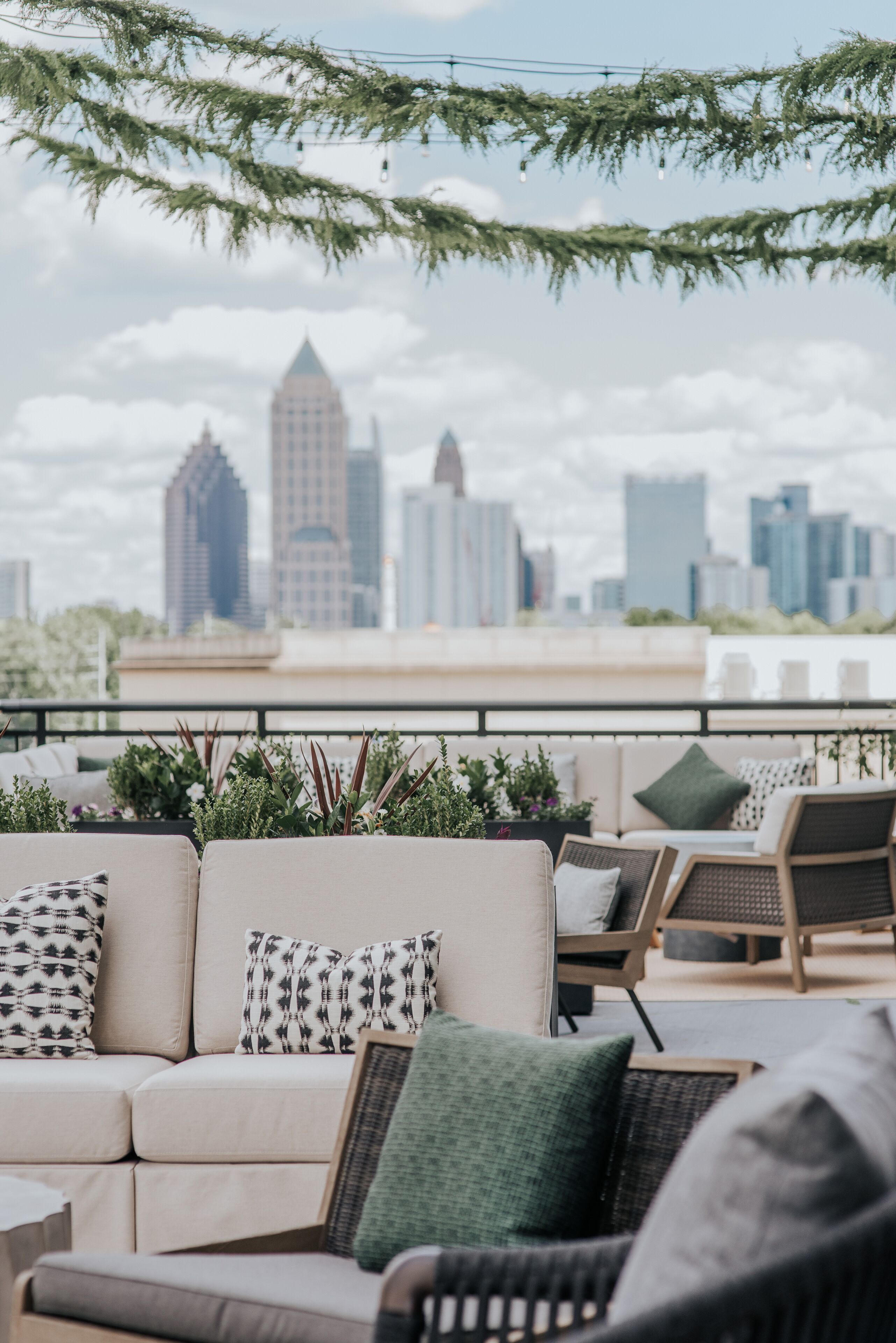 Bellyard’s terrace seating with an Atlanta skyline backdrop
