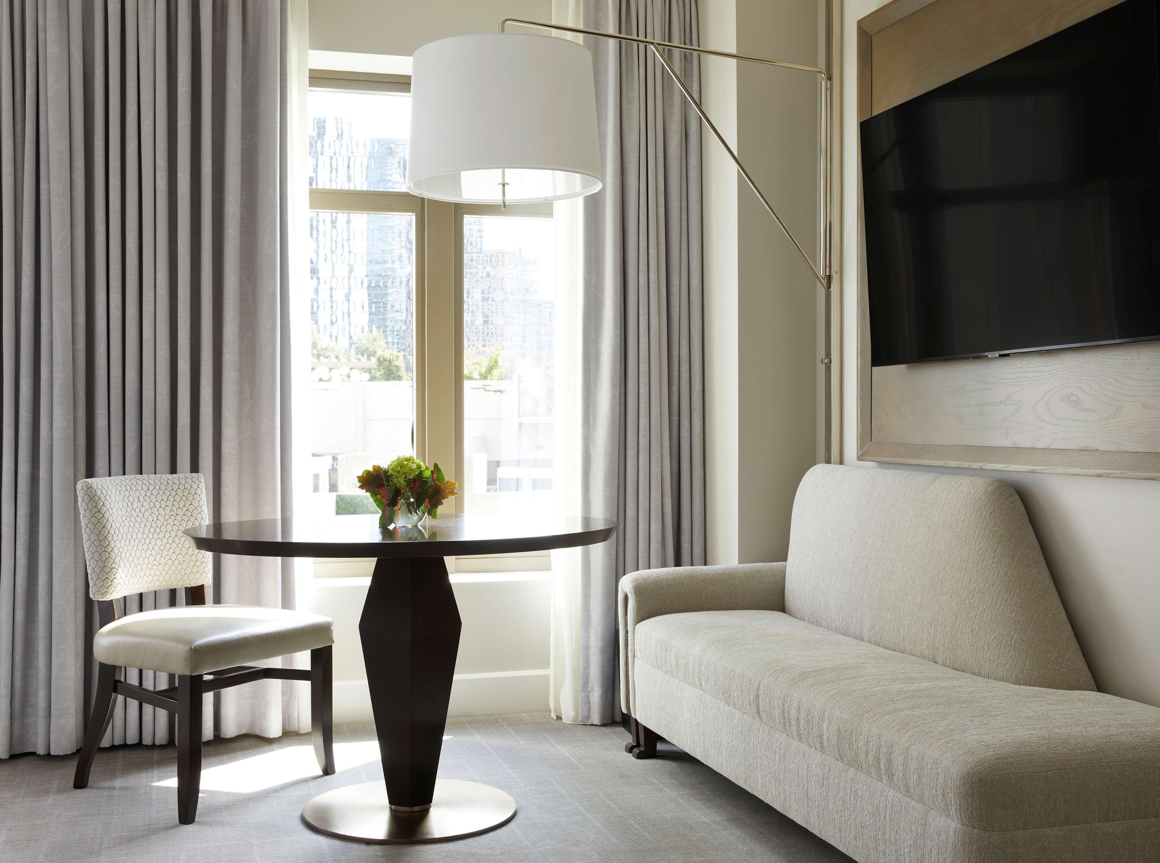 Sitting area shown with the Waldorf Astoria Atlanta Deluxe King category