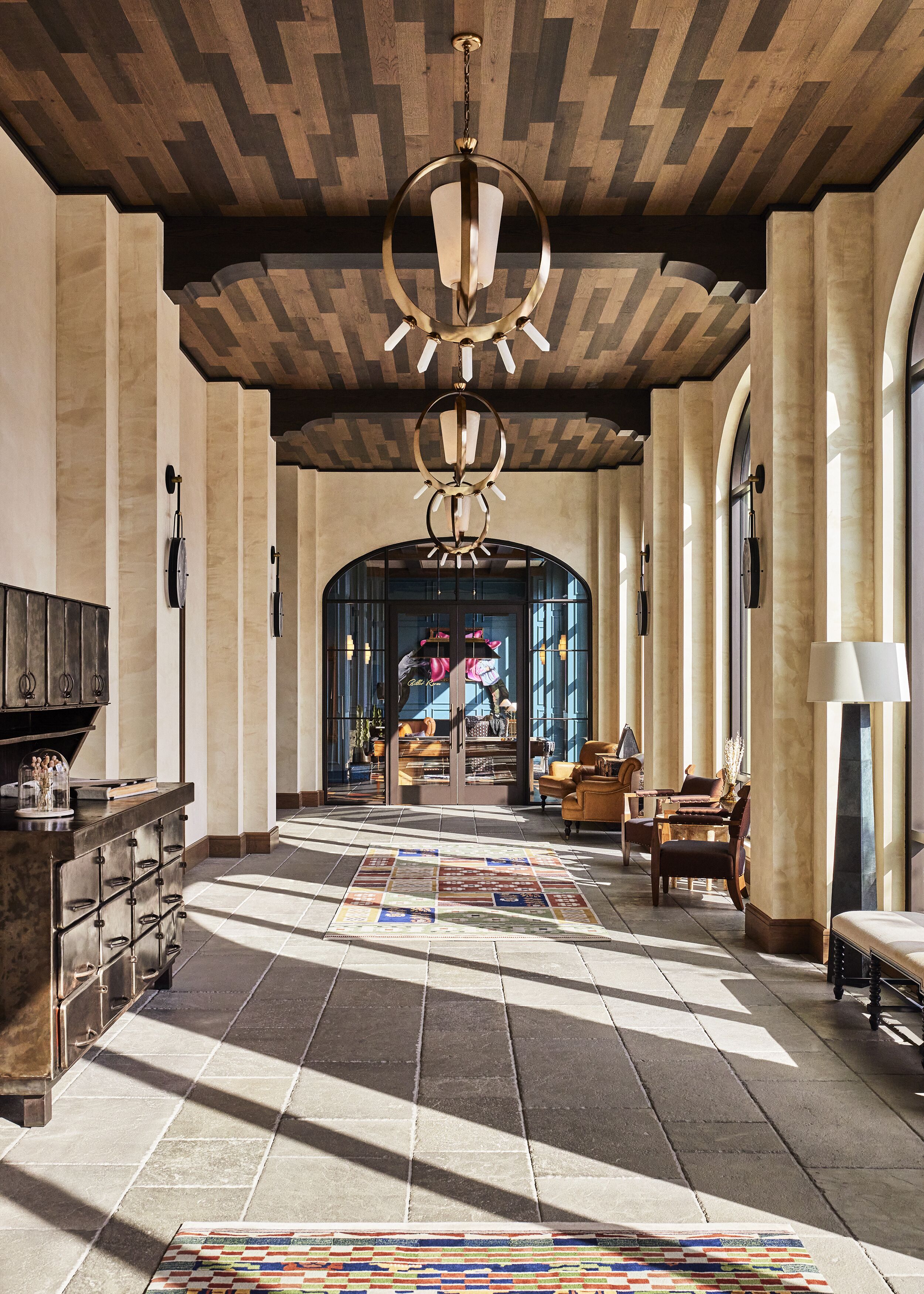 Bowie House lobby with Western-inspired furnishings and a statement chandelier