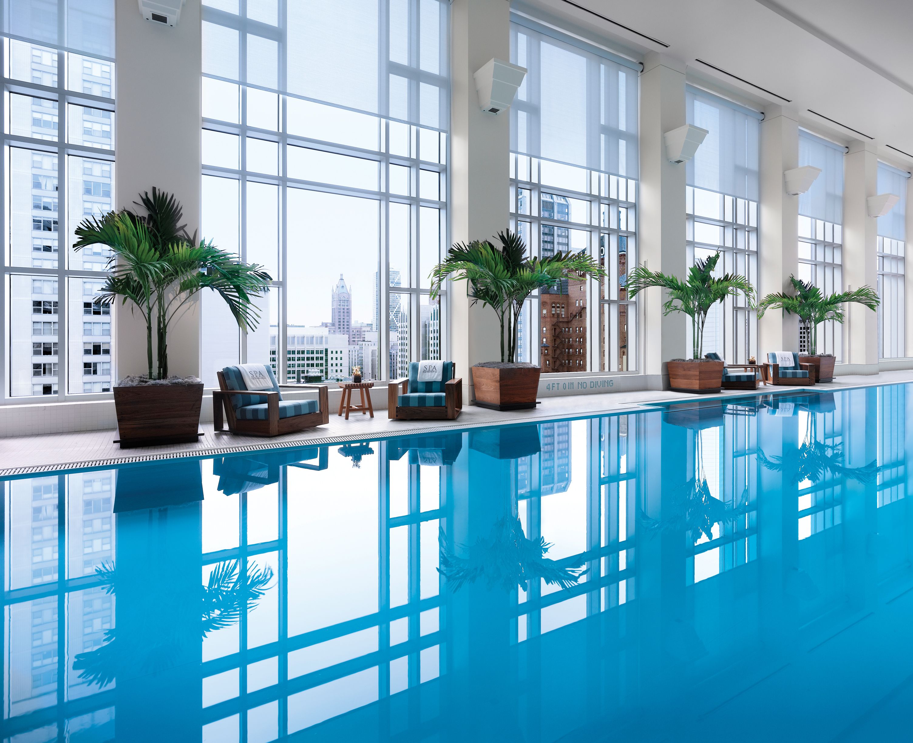 The Peninsula Chicago shared indoor pool with skyline-facing windows