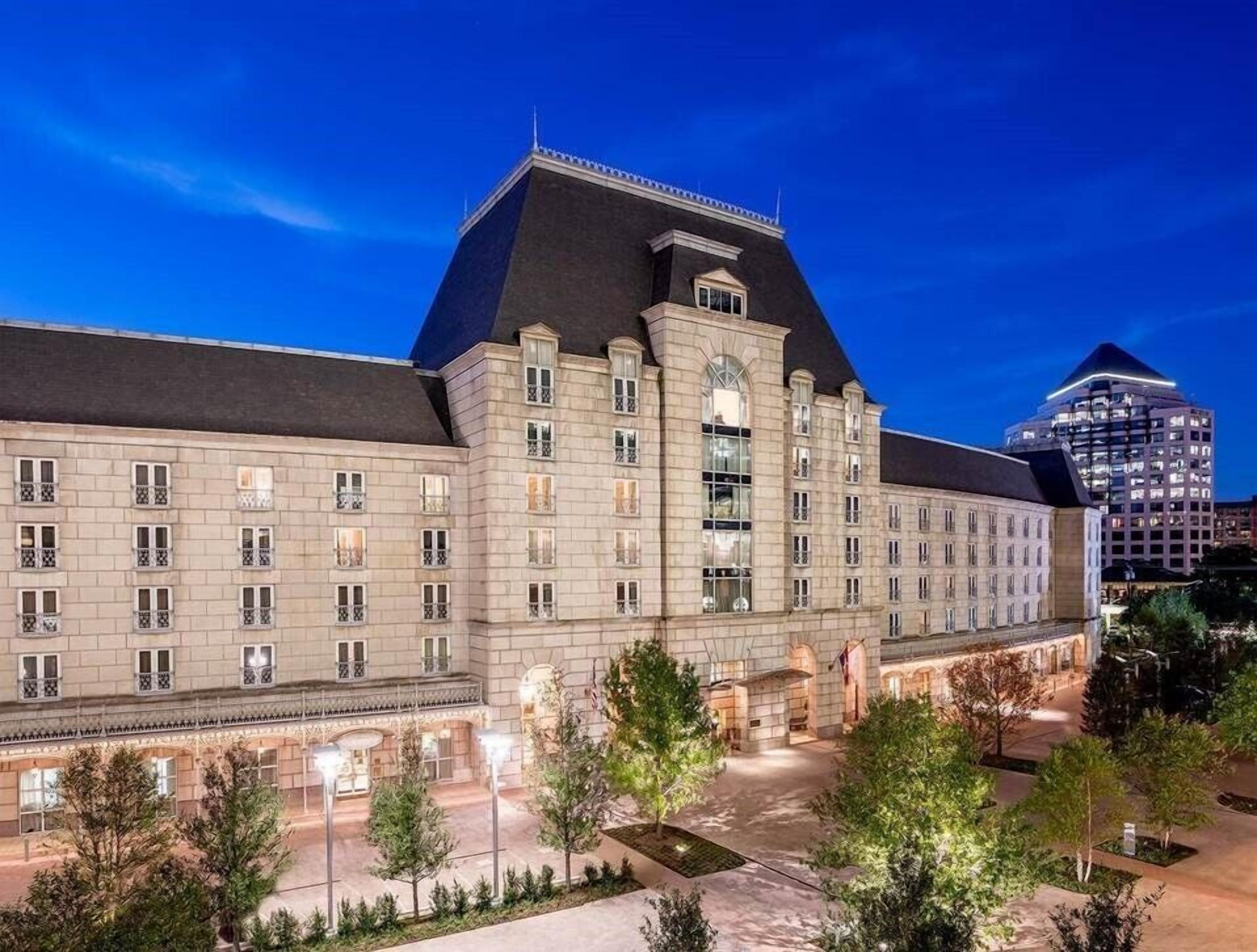 The distinctive exterior of Hotel Crescent Court in Uptown Dallas