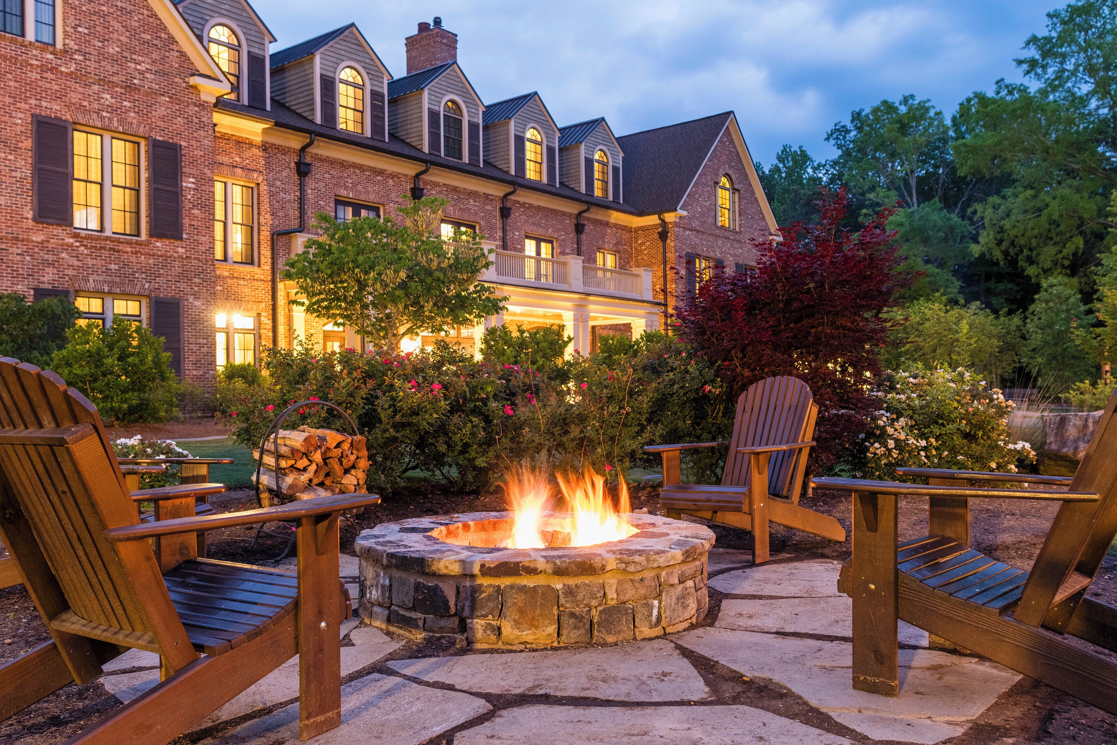 Outdoor firepit and seating among Barnsley Resort’s buildings